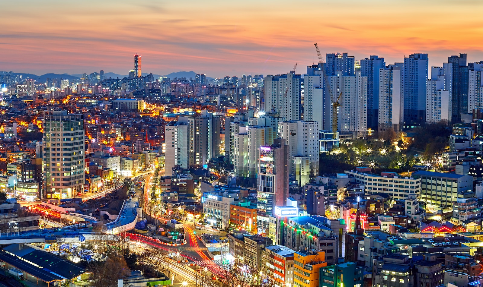 aerial photography of lighted city high rise buildings during dawn