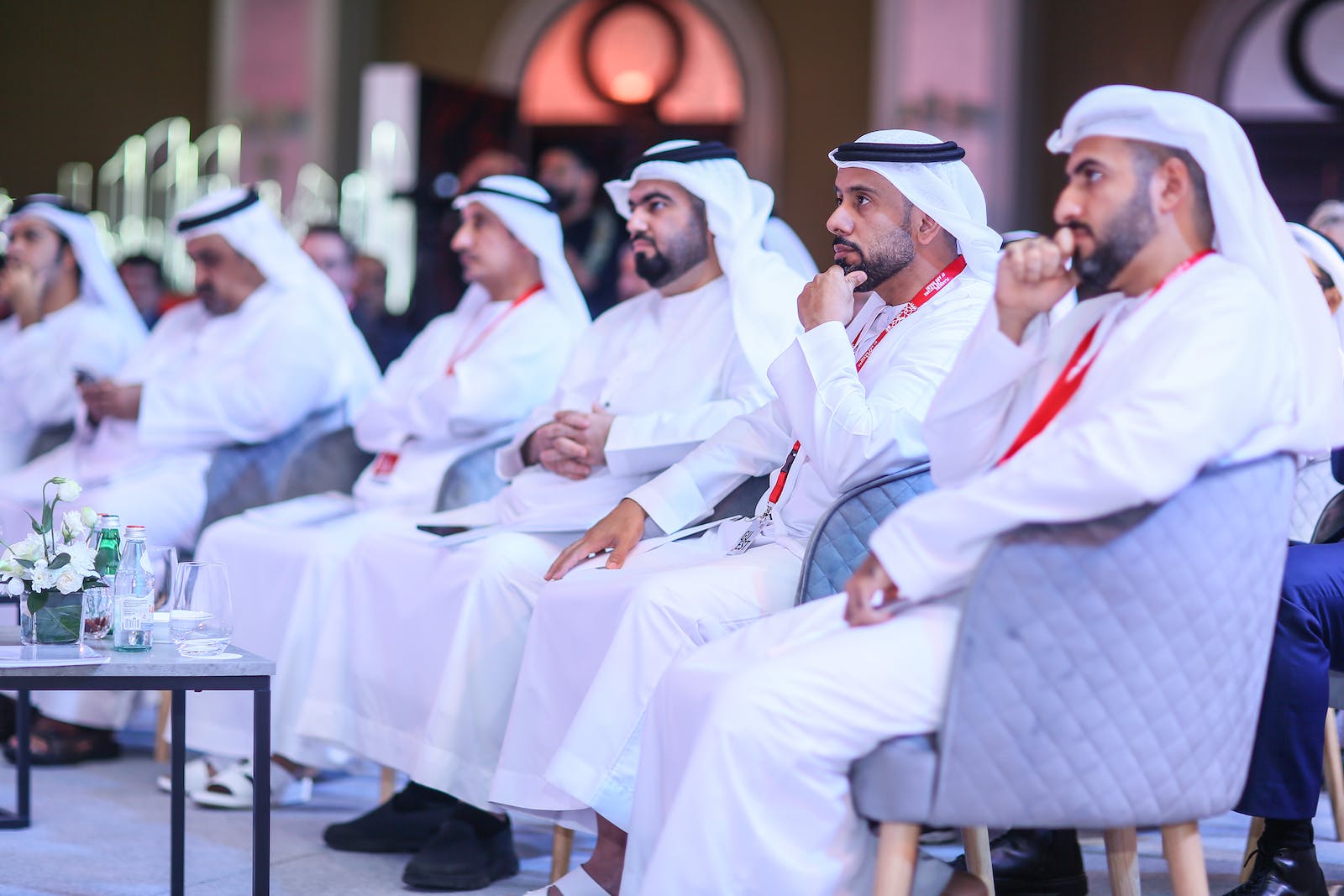 People in Traditional Clothing in a Conference