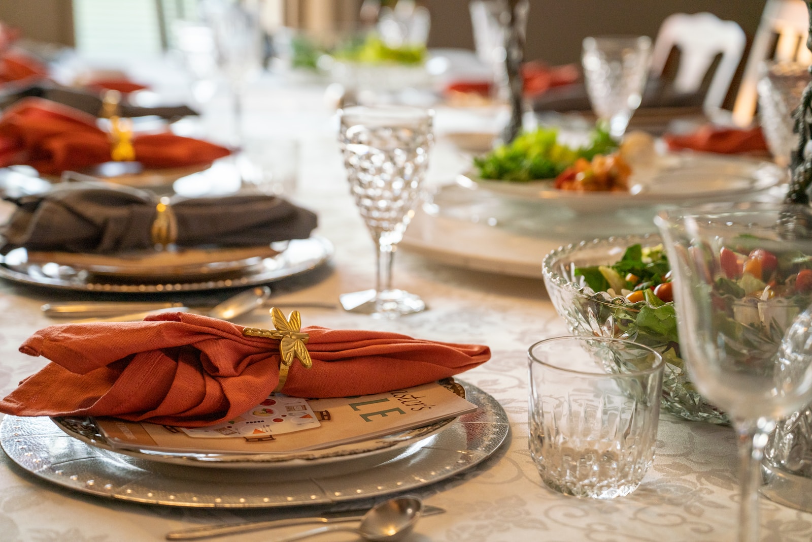 a table set with place settings and napkins