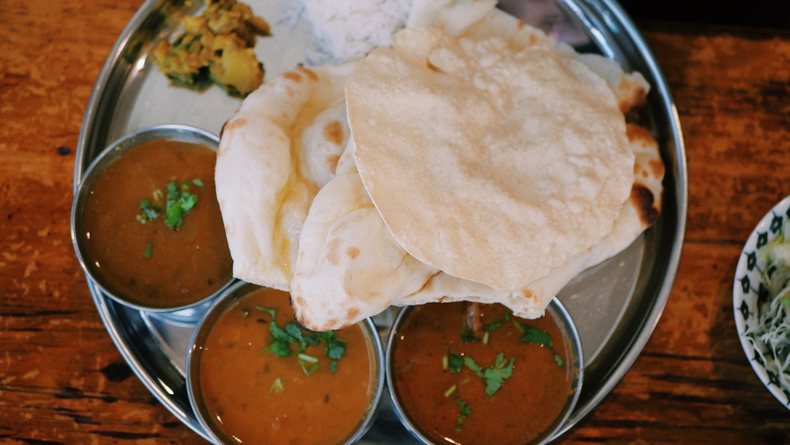 roti in round gray stainless steel tray